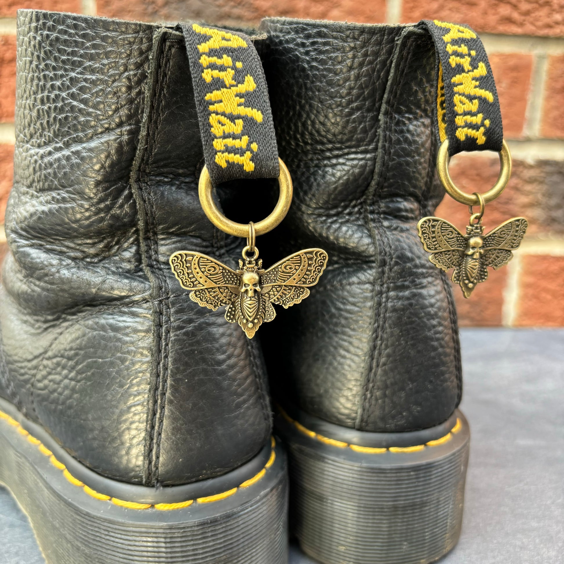 Pair of Bronze Death Moth Doc Charms